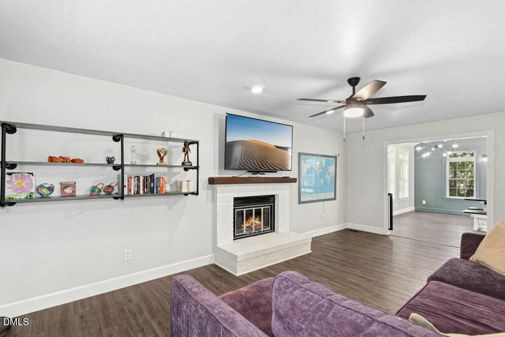 106 Village Court Garner, NC 27529 - Photo 5 of 38 a living room with furniture and a flat screen tv