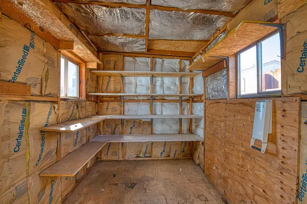 a view of an empty room with a window