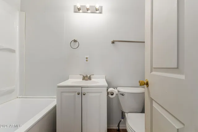 a bathroom with a sink toilet and tub