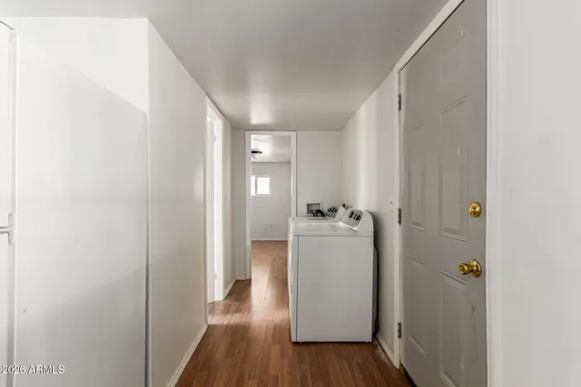 a view of a room with wooden floor