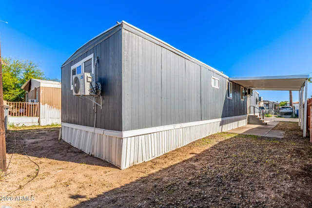 a view of a house with wooden fence