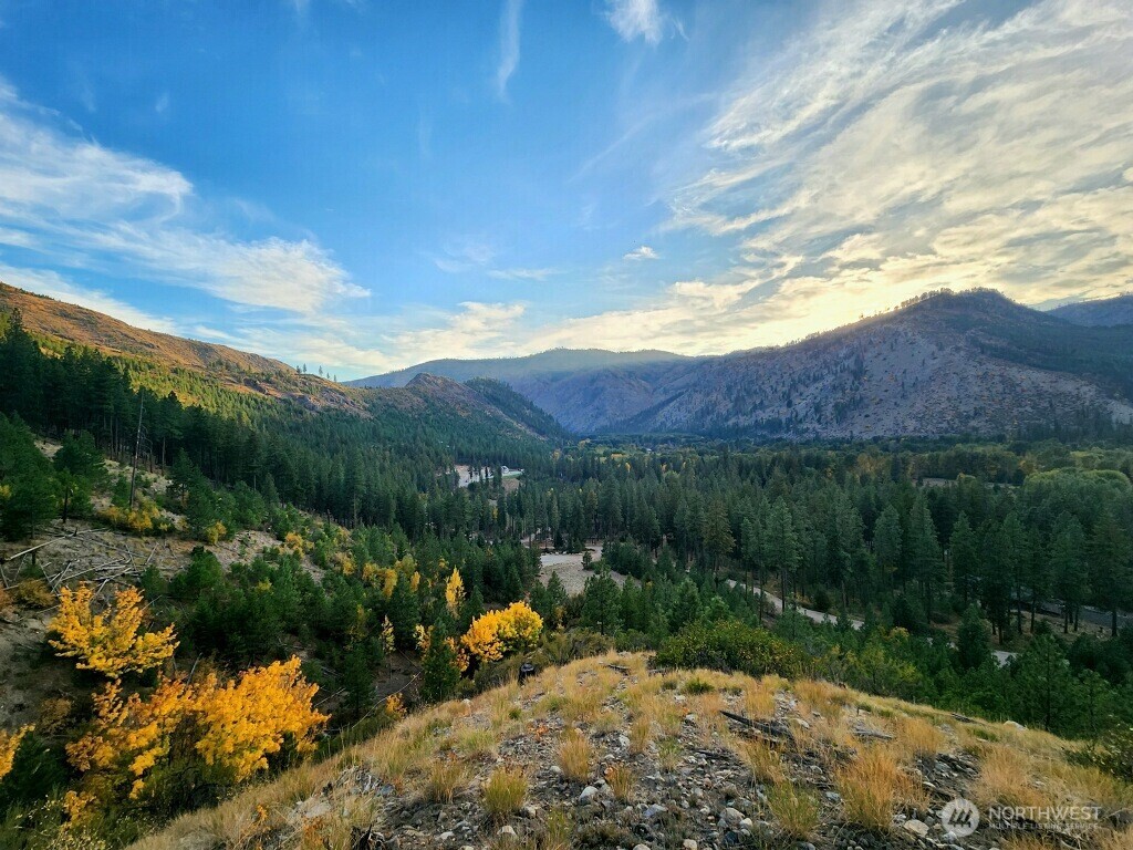 14216 Entiat River Road Entiat, WA 98822 - Photo 1 of 3 a view of a lake with a mountain in the background