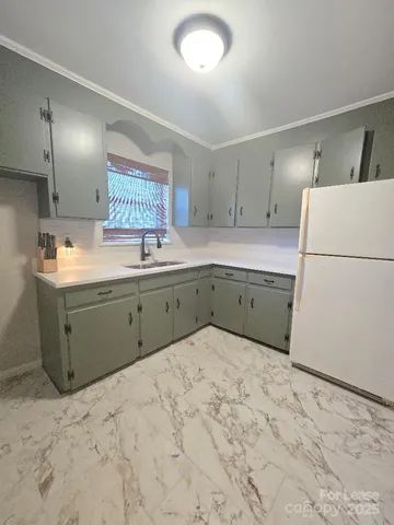 a spacious bedroom with a bed and a cabinets