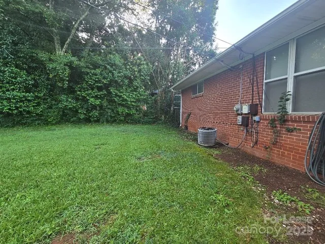 a view of a backyard with sitting area