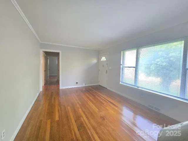 a view of an empty room and window