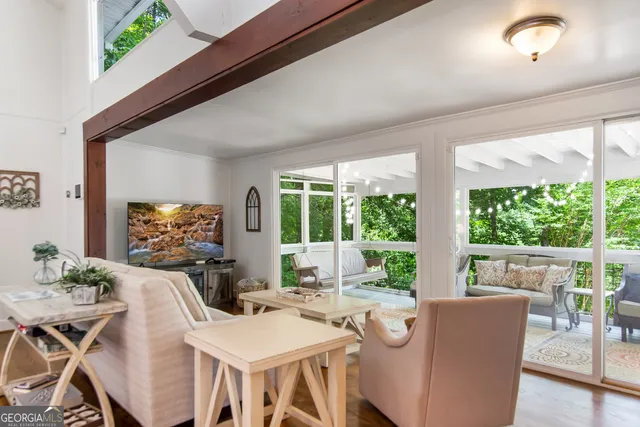 a view of a dining room with furniture window and outside view