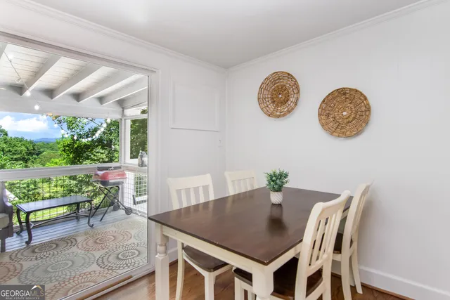 a view of a dining table and chairs in a room