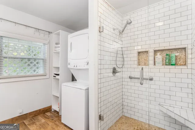 a bathroom with a sink a window and a mirror