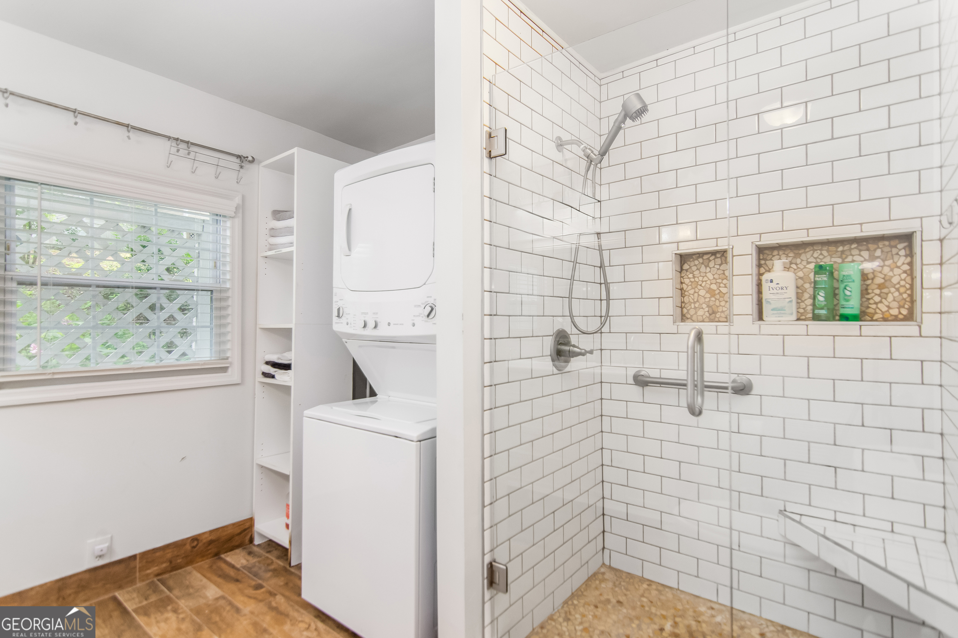 1056 Sky Hawk Mountain Road Hiawassee, GA 30546 - Photo 17 of 50 a bathroom with a sink a window and a mirror