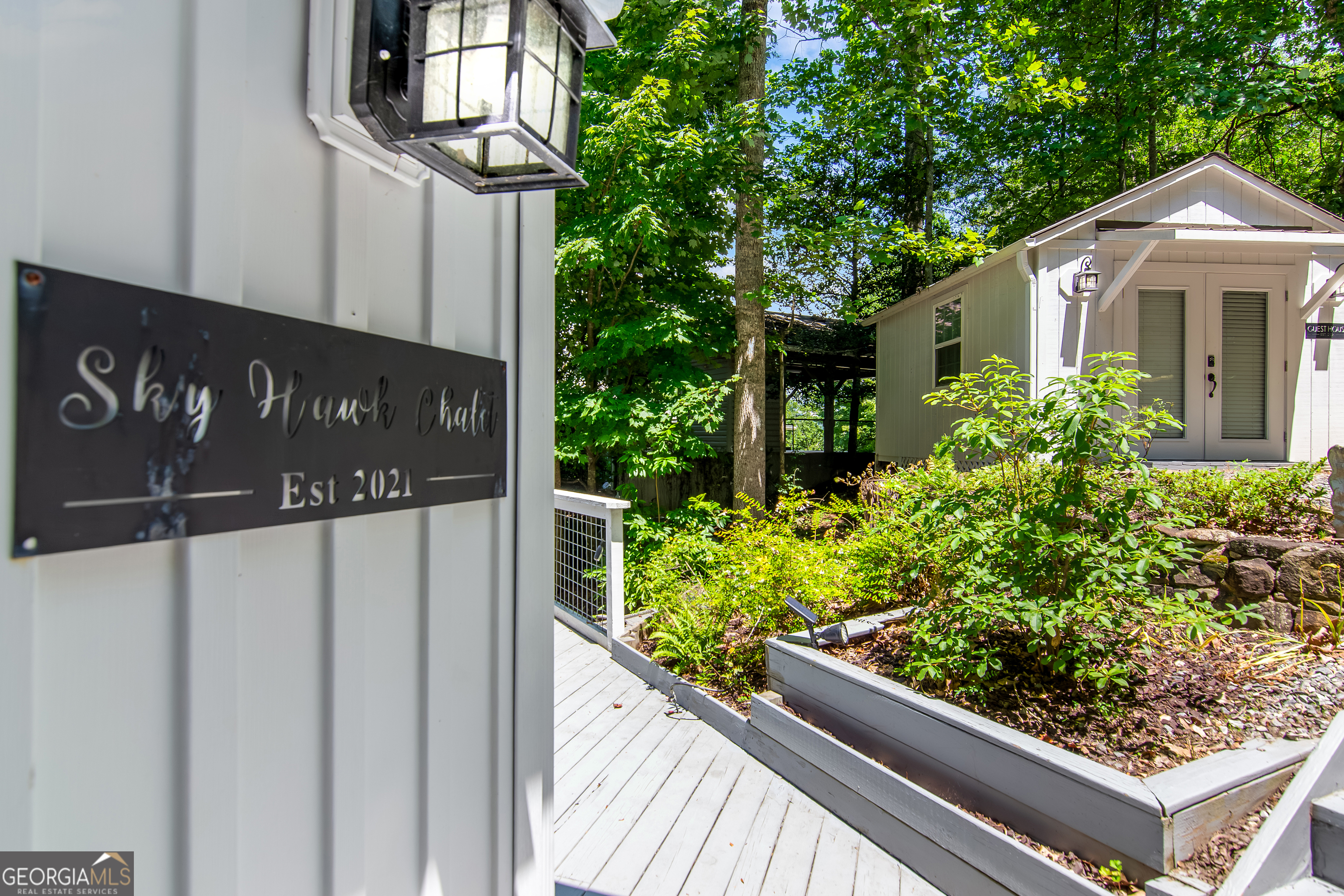 1056 Sky Hawk Mountain Road Hiawassee, GA 30546 - Photo 2 of 50 a view of a street sign under an umbrella
