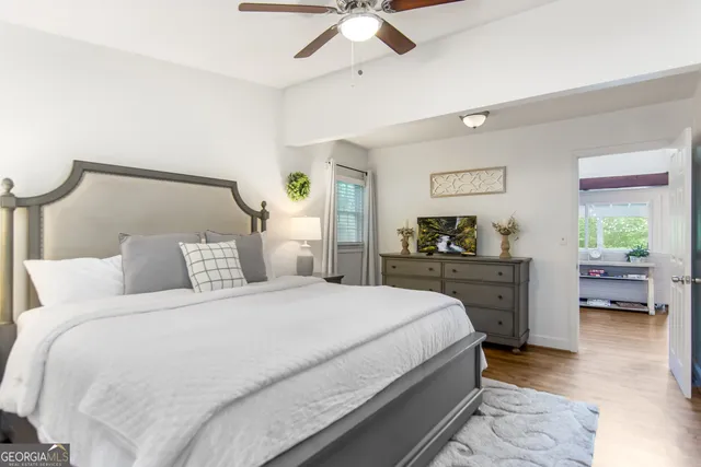 a bedroom with a bed and dresser