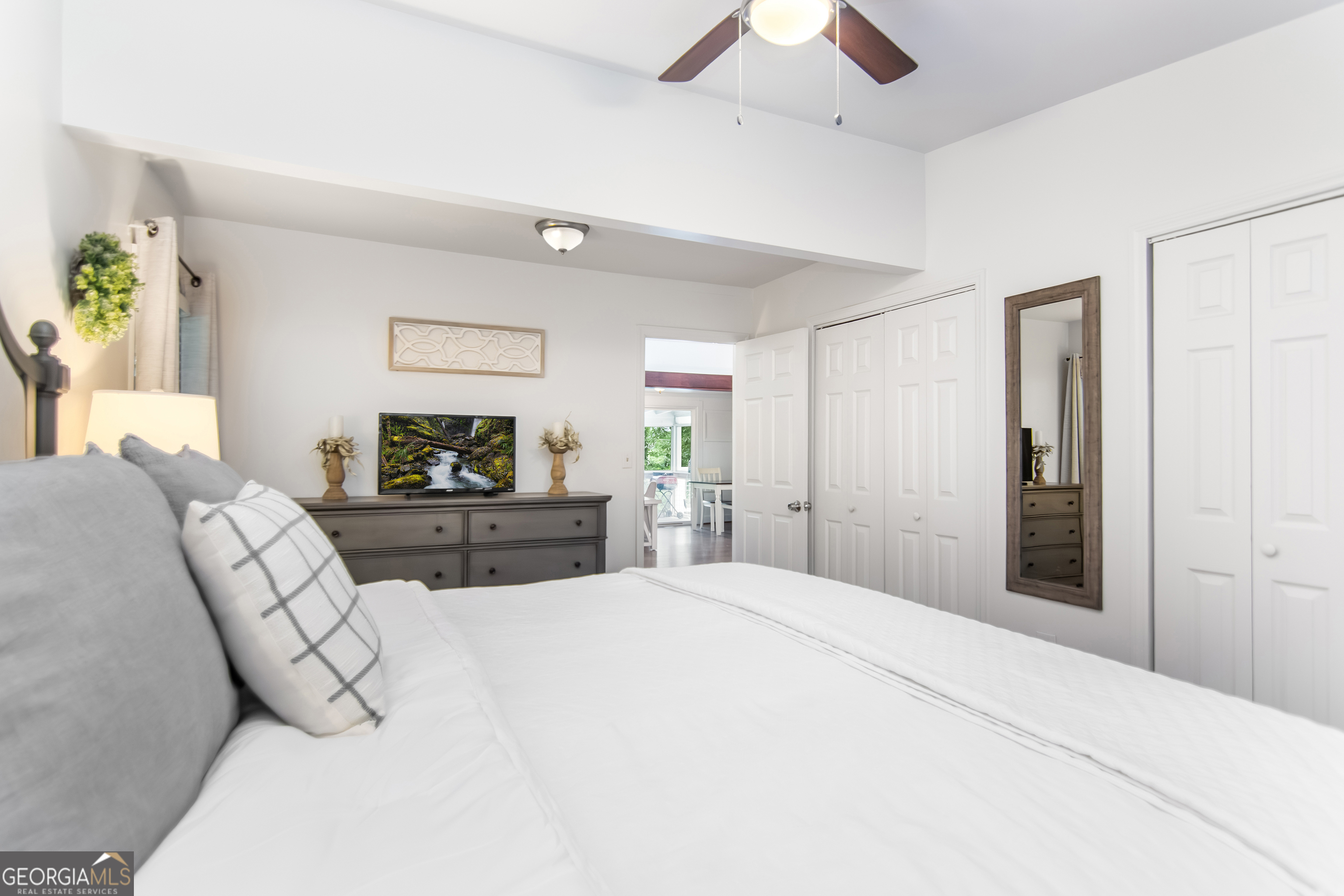 1056 Sky Hawk Mountain Road Hiawassee, GA 30546 - Photo 22 of 50 a large bedroom with a bed and a flat tv screen