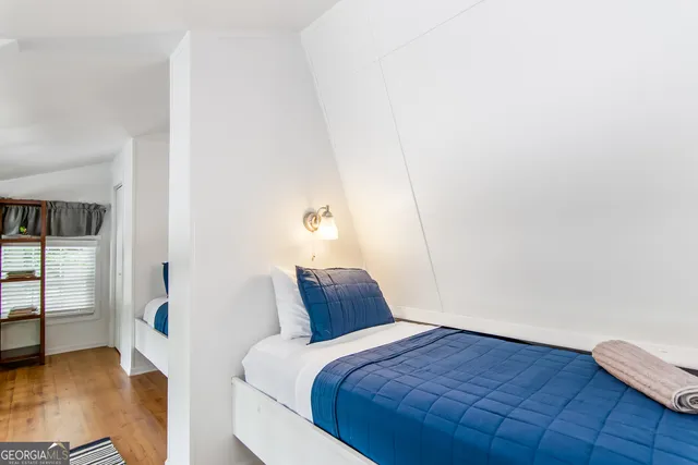 a bedroom with a bed and closet