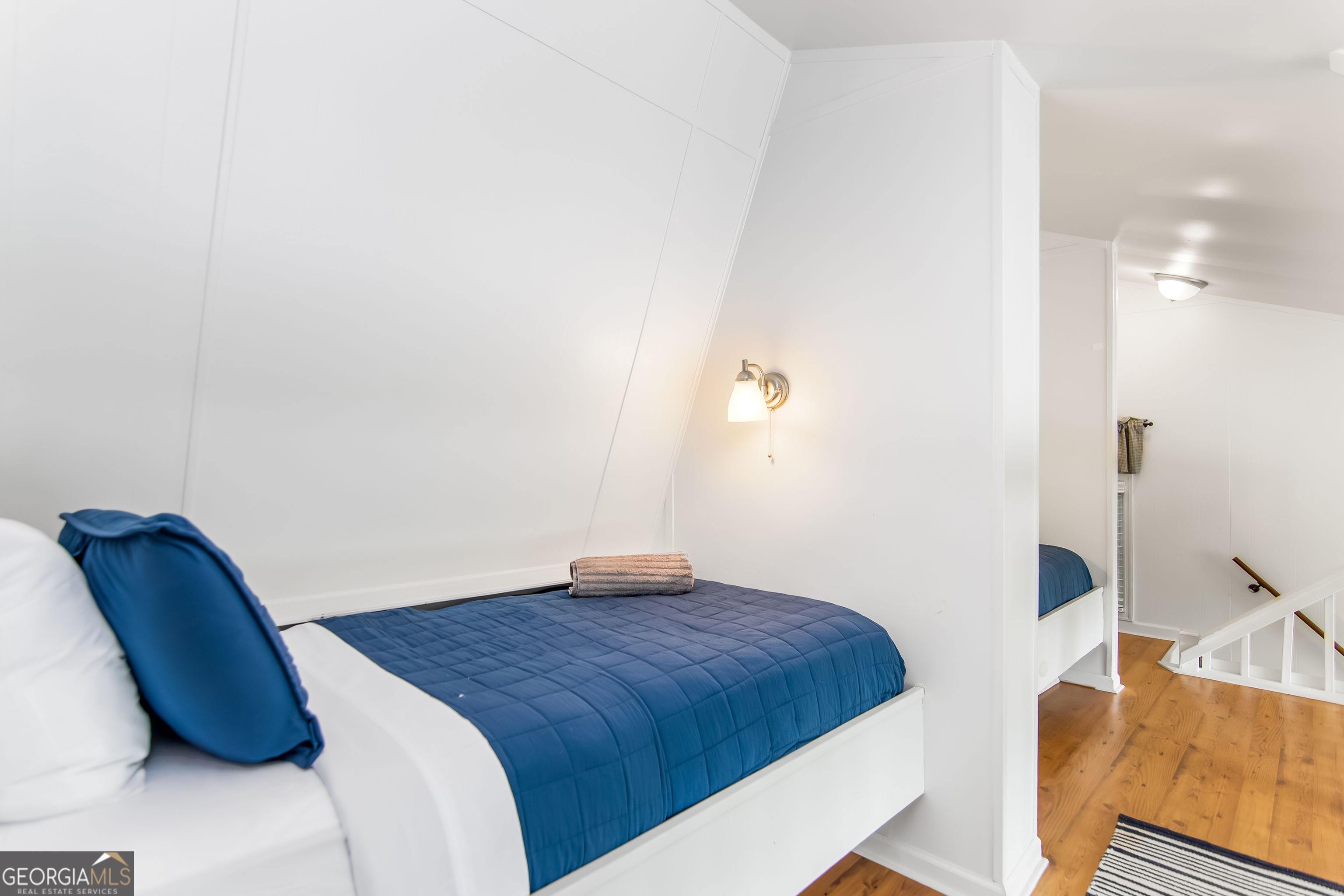 1056 Sky Hawk Mountain Road Hiawassee, GA 30546 - Photo 28 of 50 a bedroom with a bed and a chair