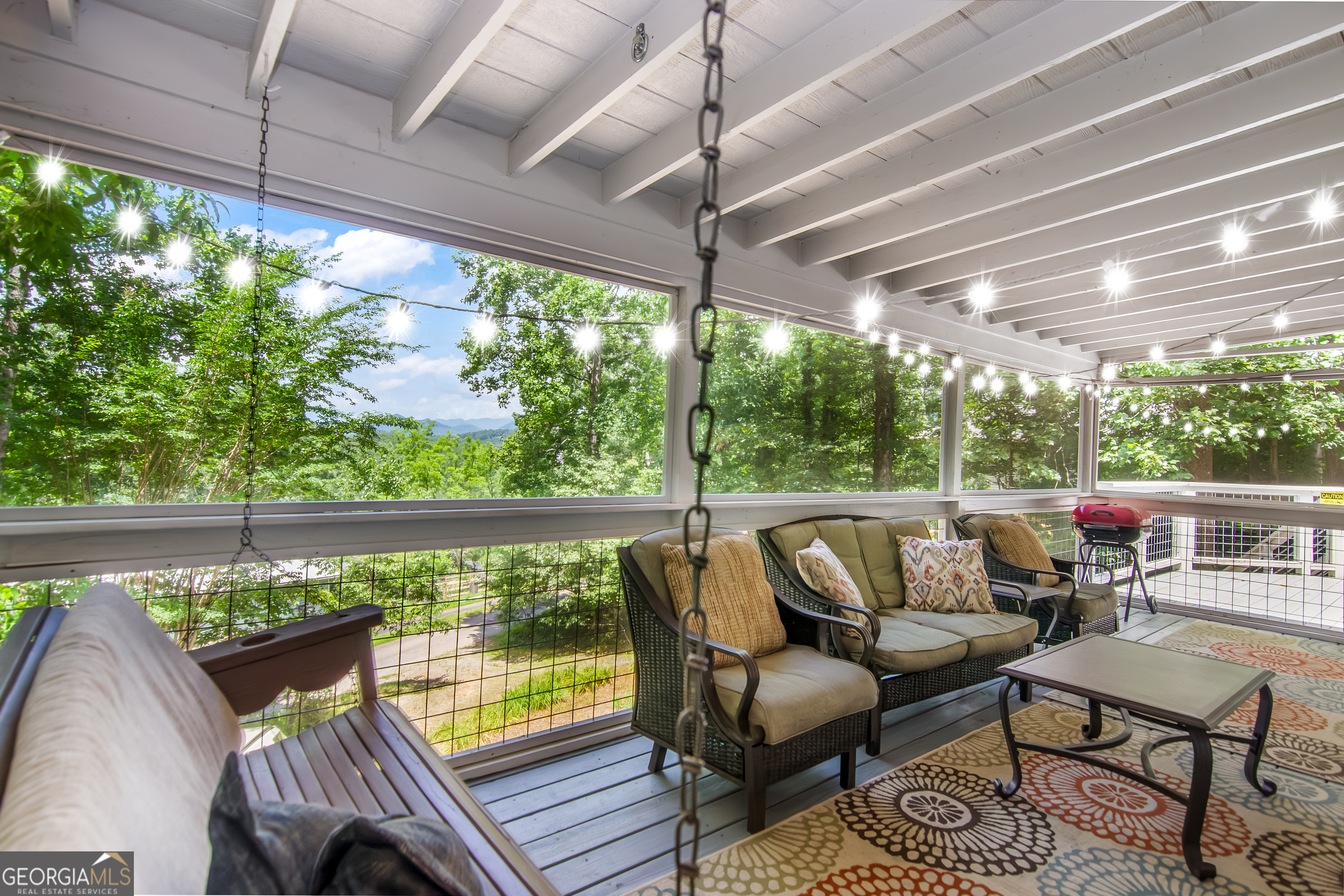 1056 Sky Hawk Mountain Road Hiawassee, GA 30546 - Photo 30 of 50 a balcony with furniture and a potted plant