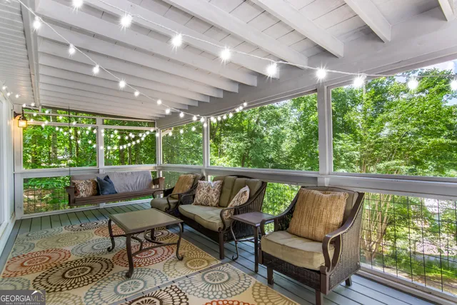 a balcony with furniture and a garden