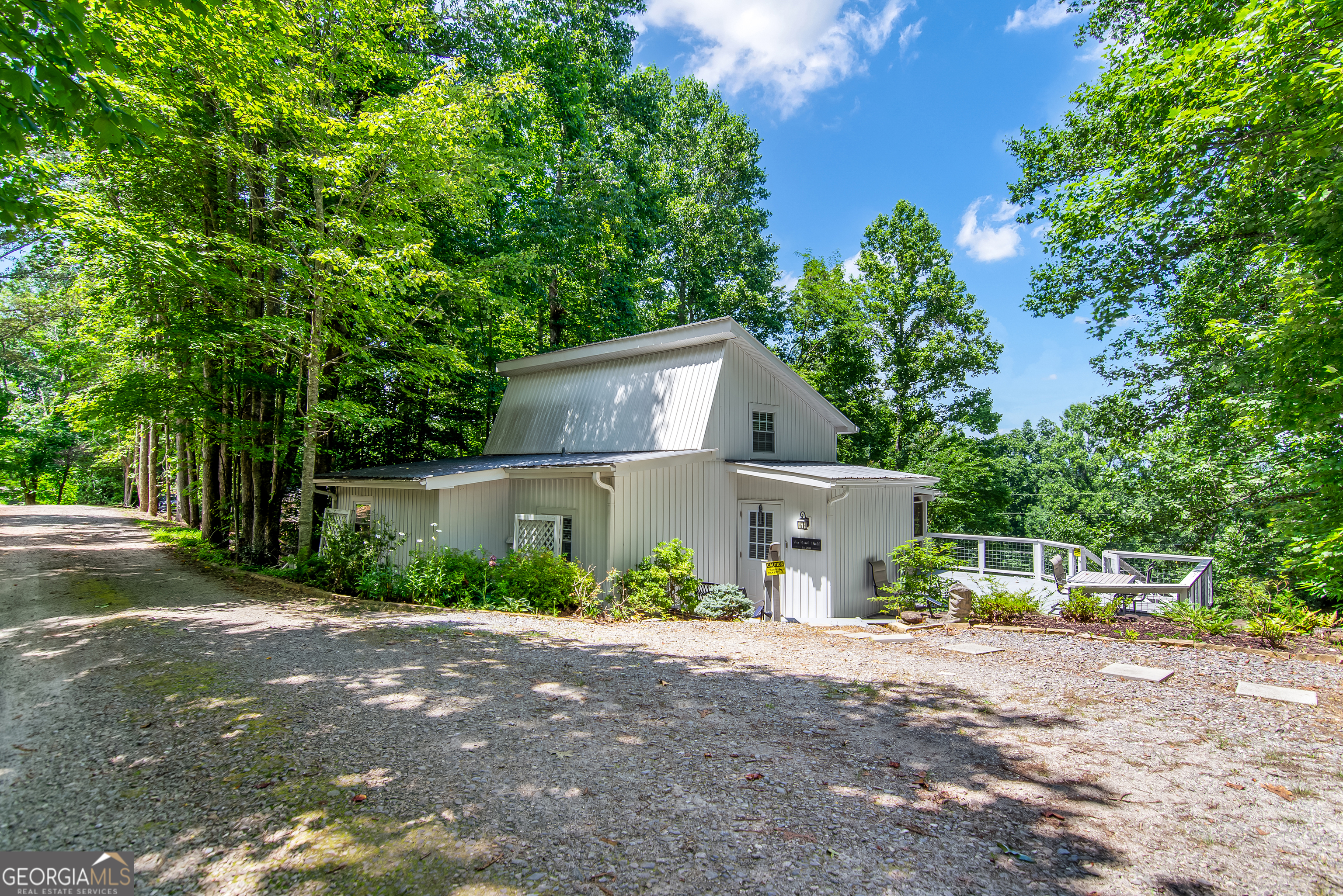 1056 Sky Hawk Mountain Road Hiawassee, GA 30546 - Photo 35 of 50 front view of a house with a street