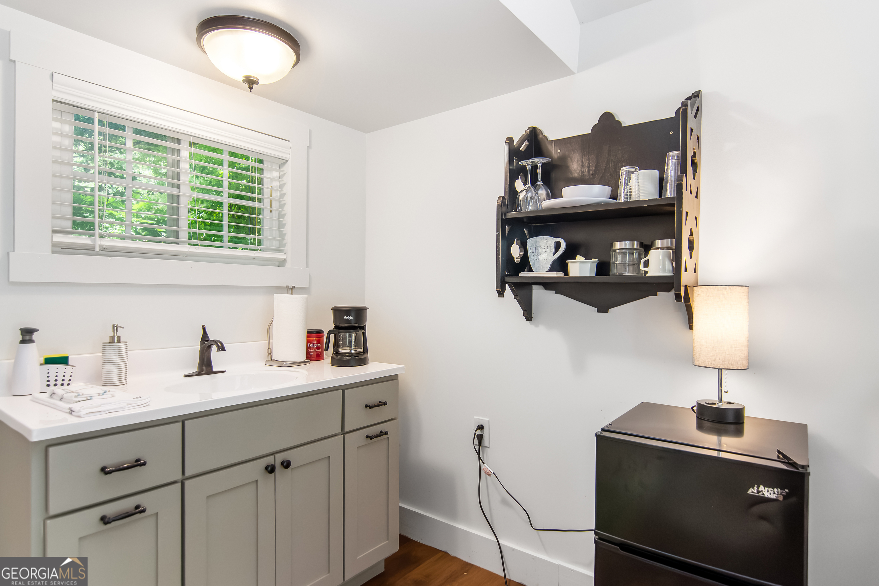 1056 Sky Hawk Mountain Road Hiawassee, GA 30546 - Photo 40 of 50 a kitchen with cabinets and window