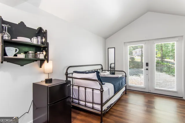 a bedroom with furniture and a window