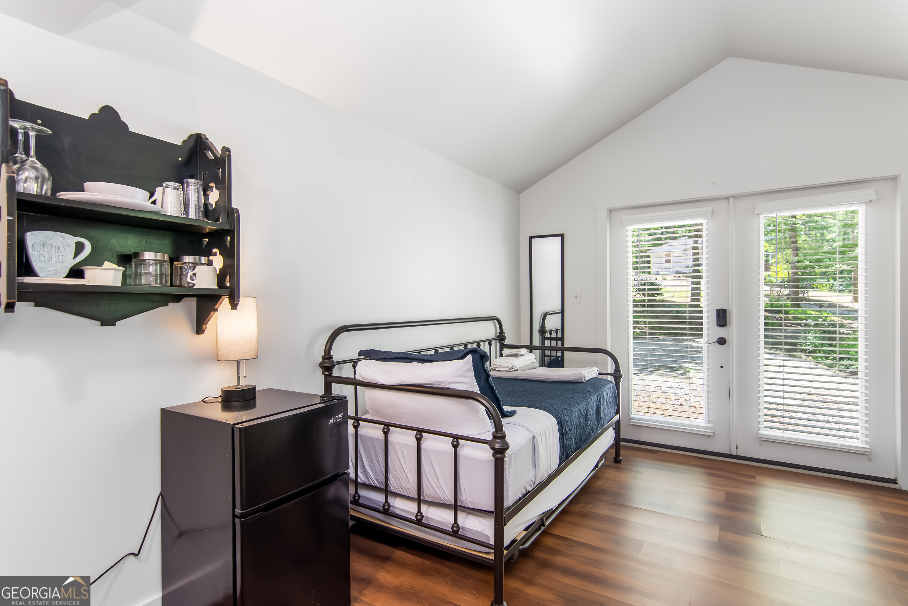 1056 Sky Hawk Mountain Road Hiawassee, GA 30546 - Photo 43 of 50 a bedroom with furniture and a window