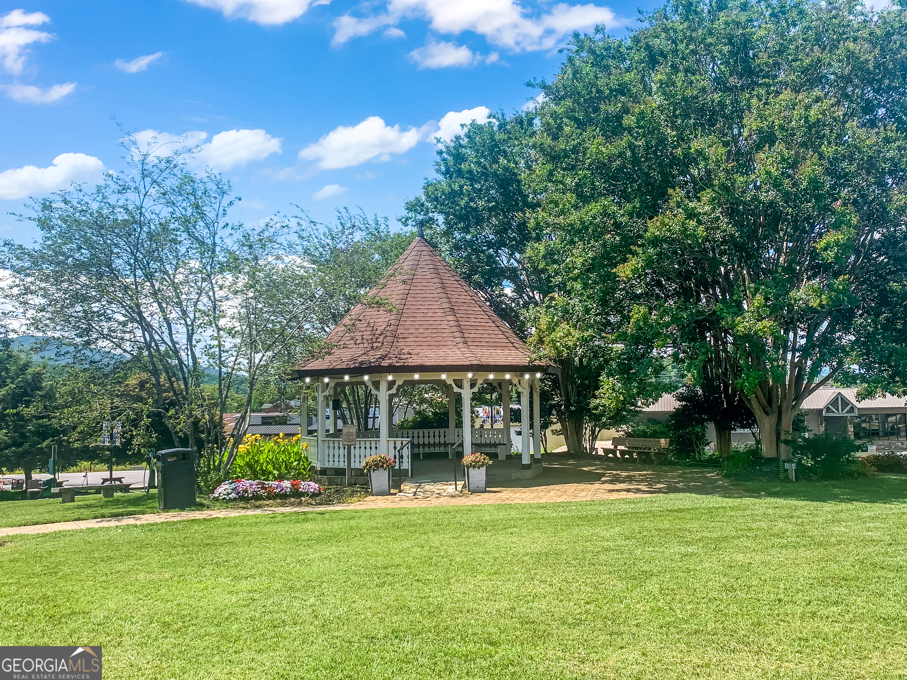 1056 Sky Hawk Mountain Road Hiawassee, GA 30546 - Photo 48 of 50 a backyard of a house with yard and outdoor seating