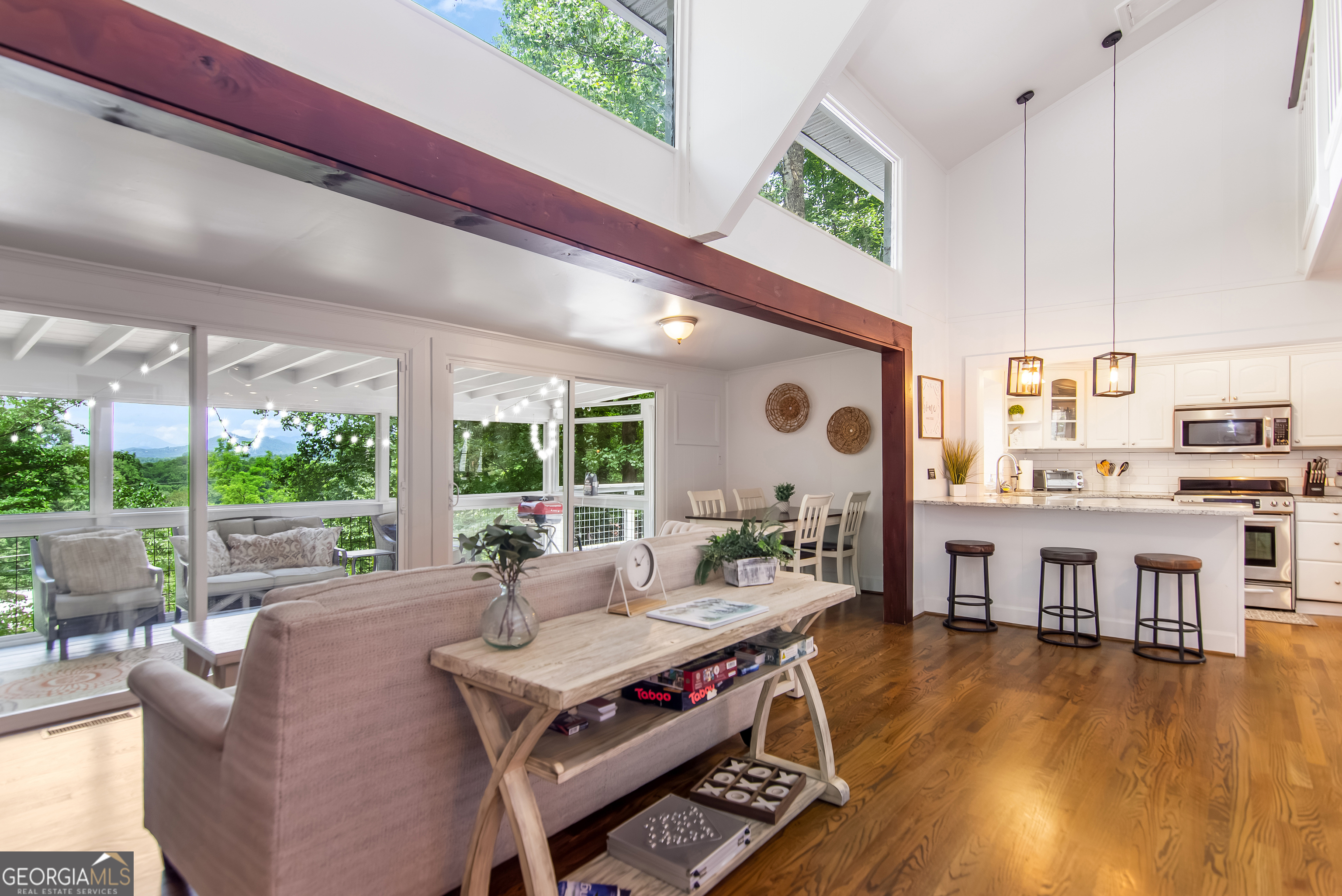 1056 Sky Hawk Mountain Road Hiawassee, GA 30546 - Photo 10 of 50 a living room with furniture and a wooden floor