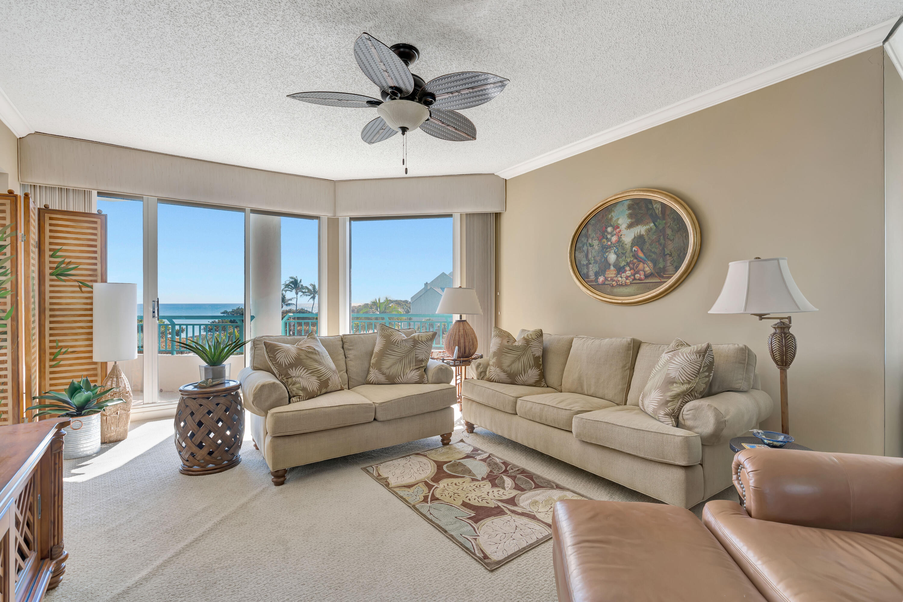 2000 Florida A1A, Unit N302 Jupiter, FL 33477 - Photo 17 of 65 a living room with furniture and a large window
