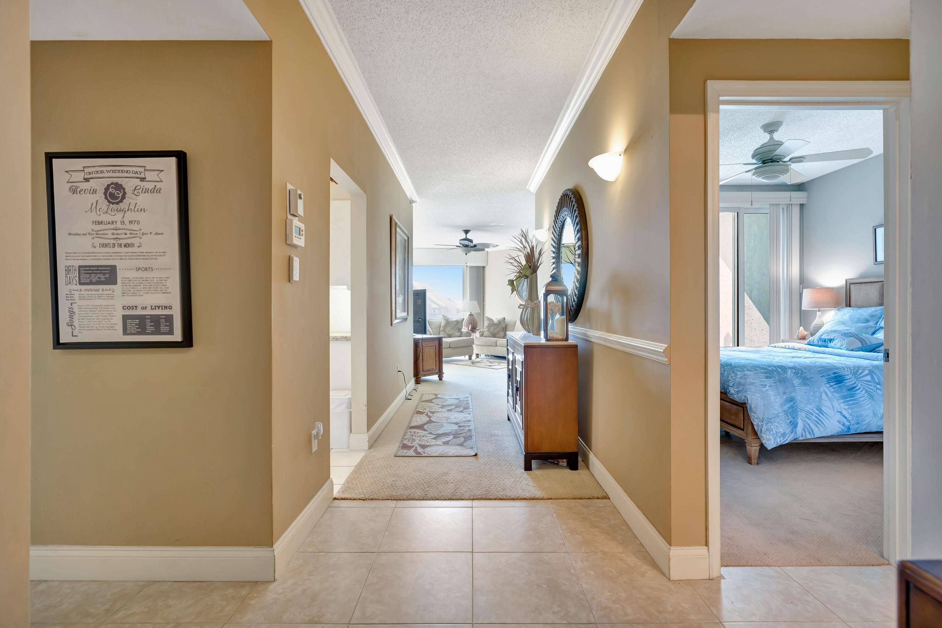 2000 Florida A1A, Unit N302 Jupiter, FL 33477 - Photo 32 of 65 a view of living room filled with furniture and a mirror