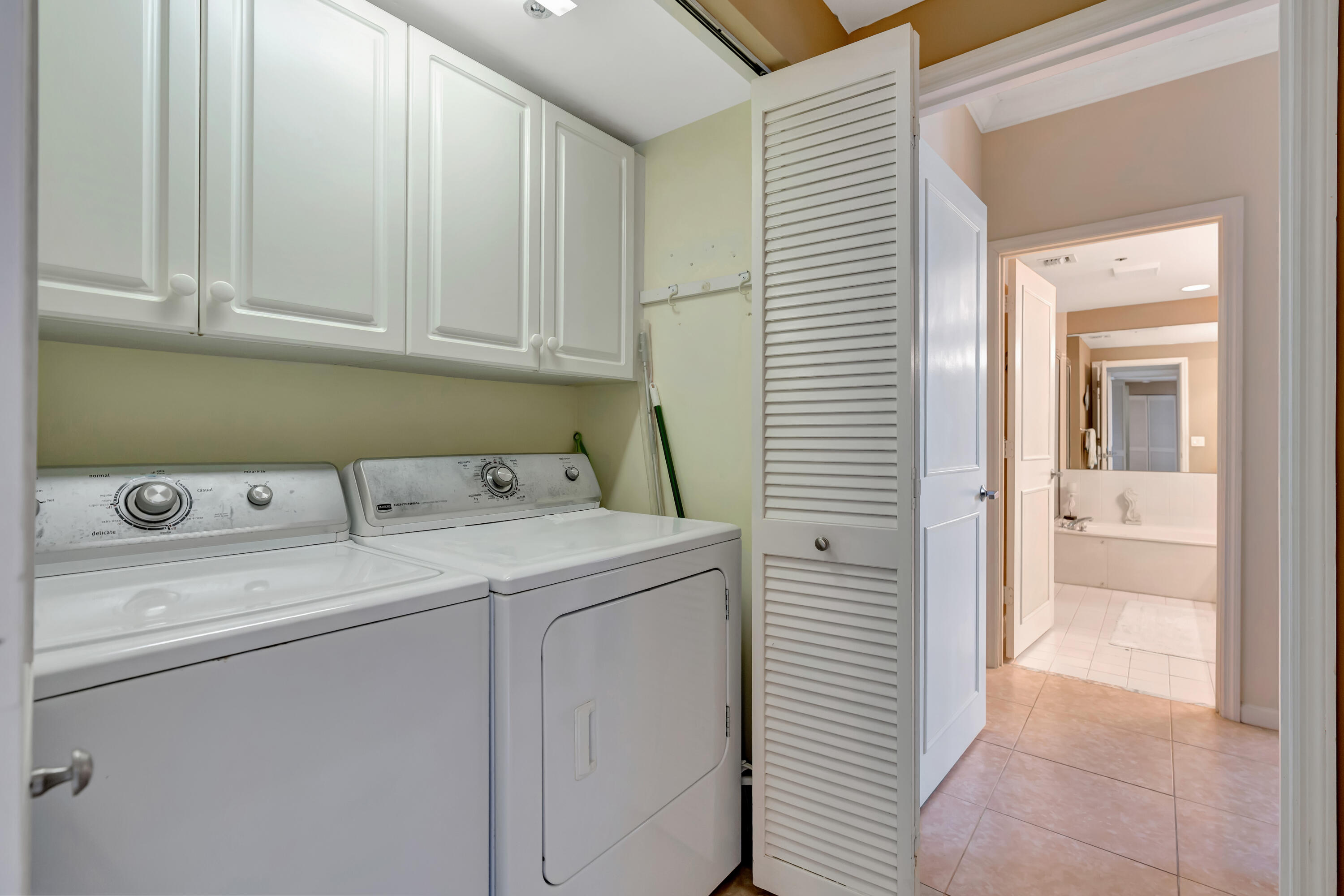 2000 Florida A1A, Unit N302 Jupiter, FL 33477 - Photo 34 of 65 a utility room with dryer and washer