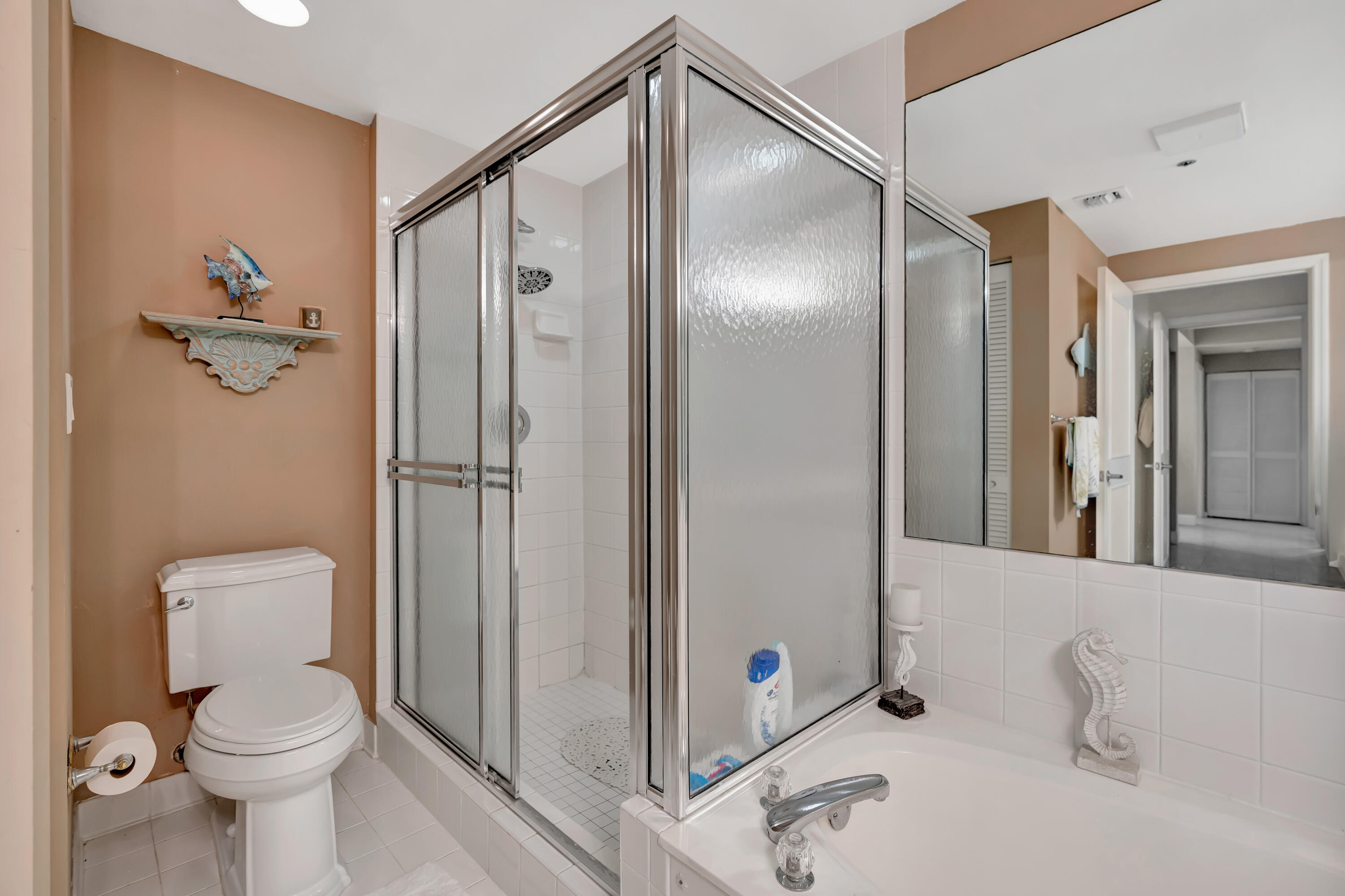 2000 Florida A1A, Unit N302 Jupiter, FL 33477 - Photo 39 of 65 a bathroom with a toilet sink and shower