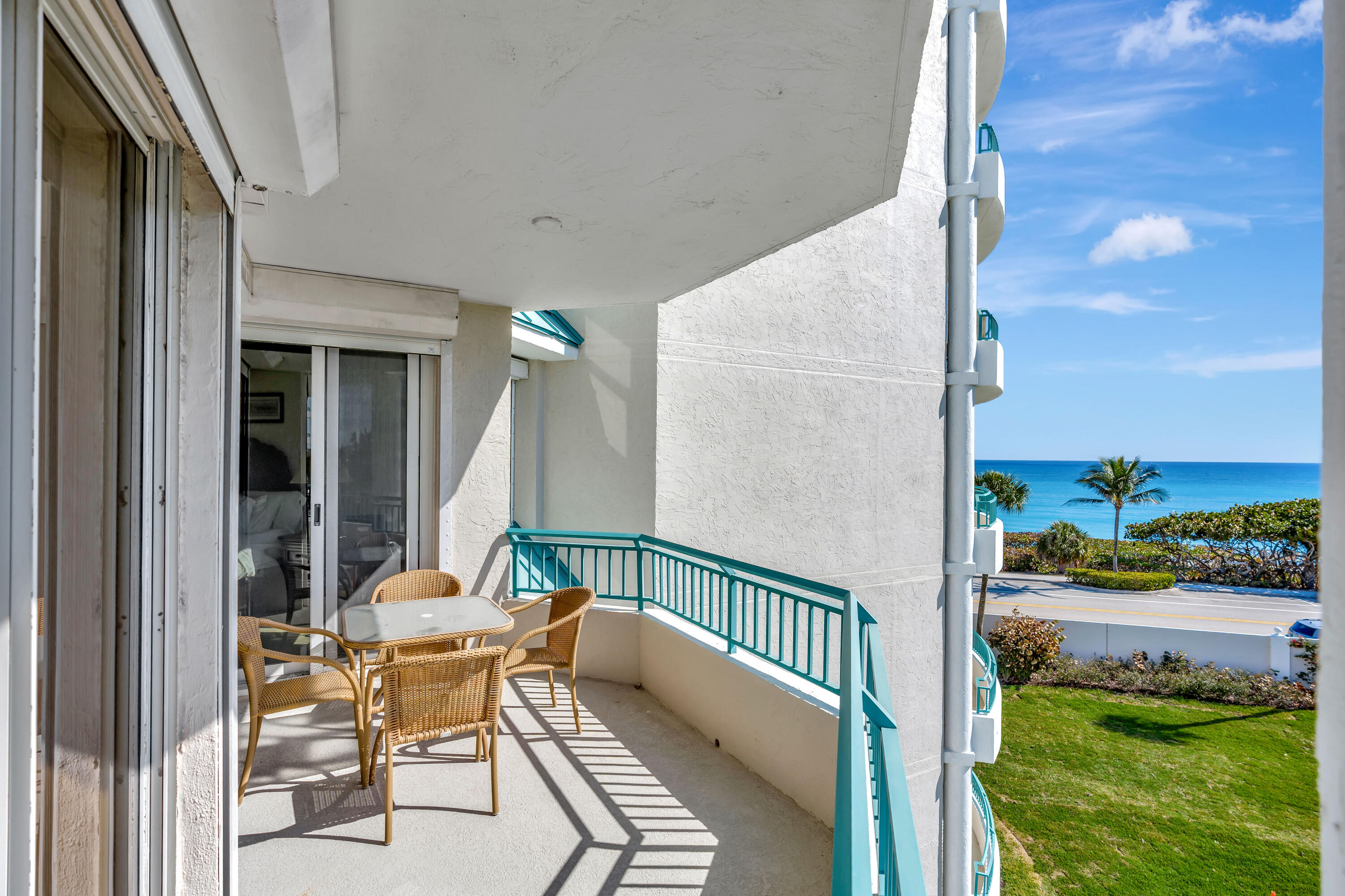 2000 Florida A1A, Unit N302 Jupiter, FL 33477 - Photo 48 of 65 a balcony with table and chairs