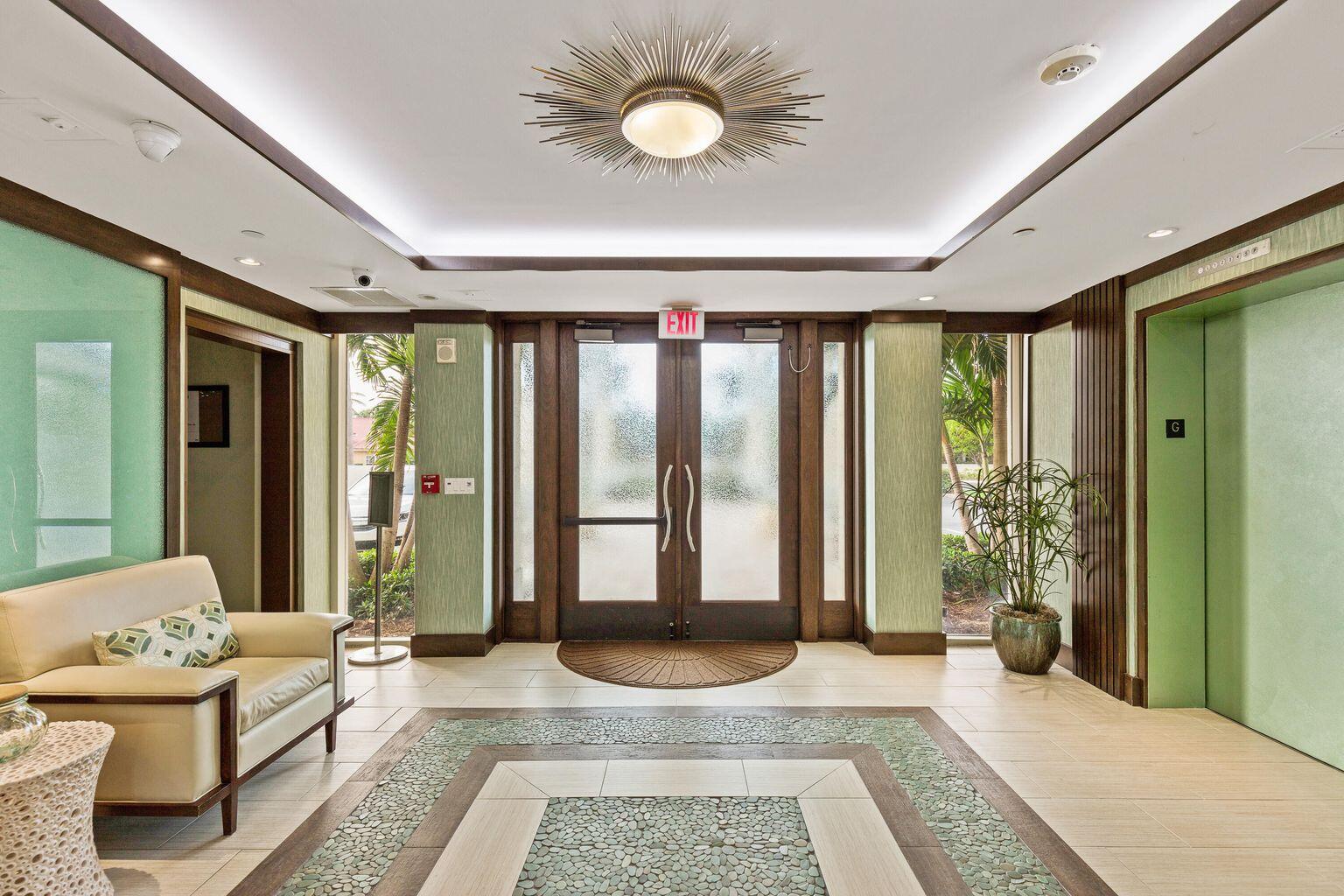 2000 Florida A1A, Unit N302 Jupiter, FL 33477 - Photo 53 of 65 a spacious bedroom with a balcony a large bed and a large window