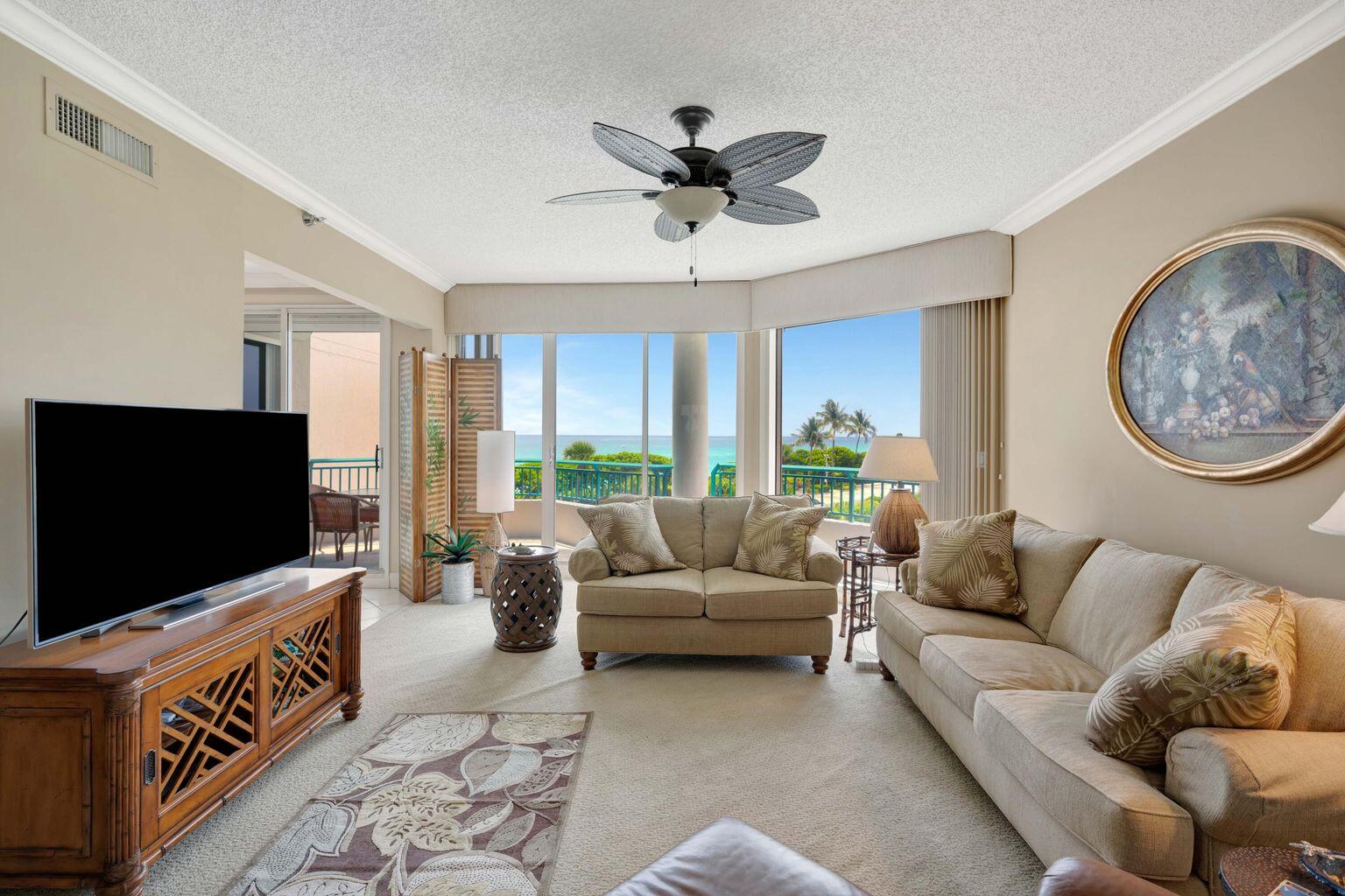 2000 Florida A1A, Unit N302 Jupiter, FL 33477 - Photo 9 of 65 a living room with furniture and a flat screen tv