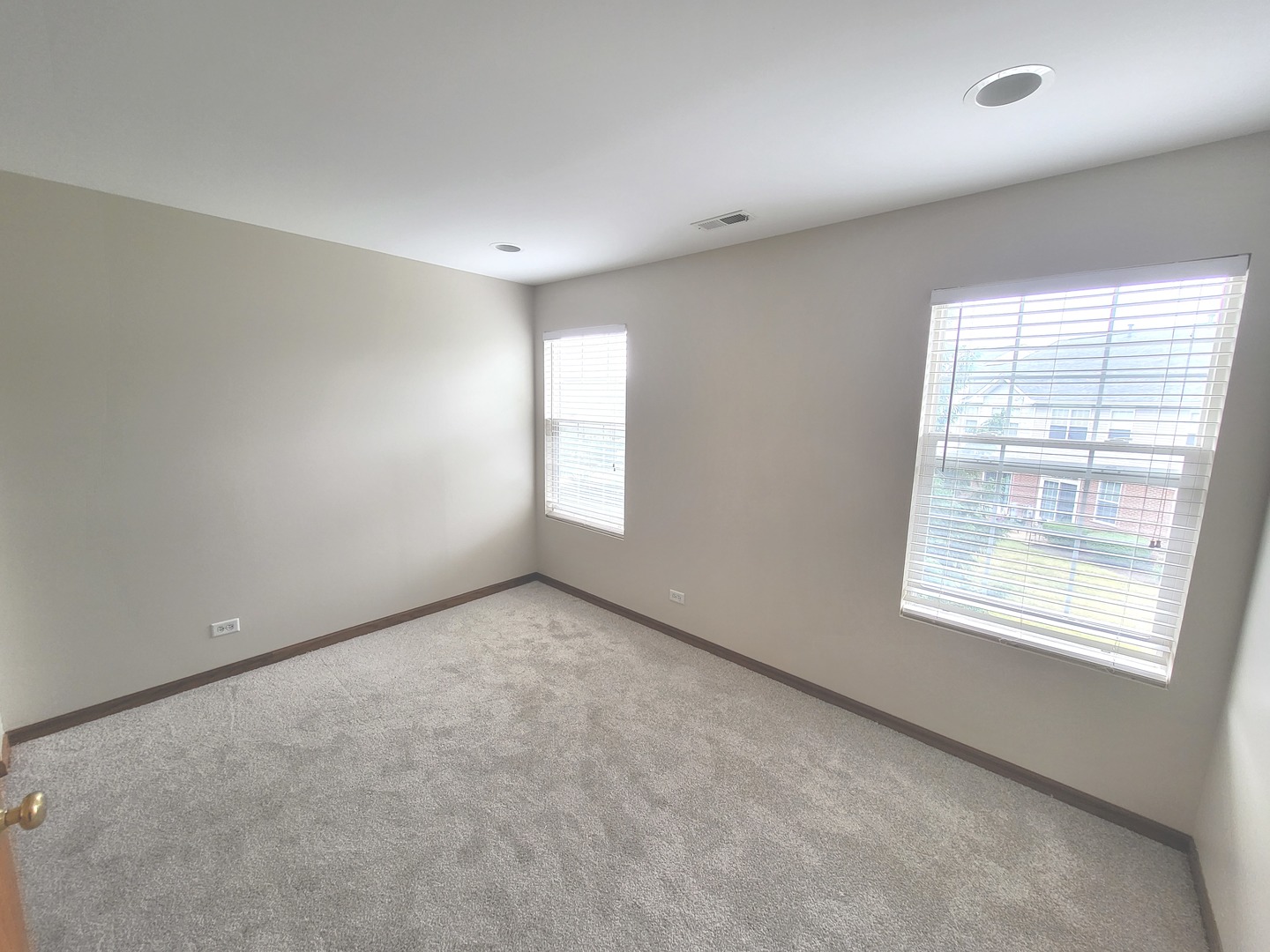 24213 Walnut Circle Plainfield, IL 60585 - Photo 11 of 15 an empty room with windows