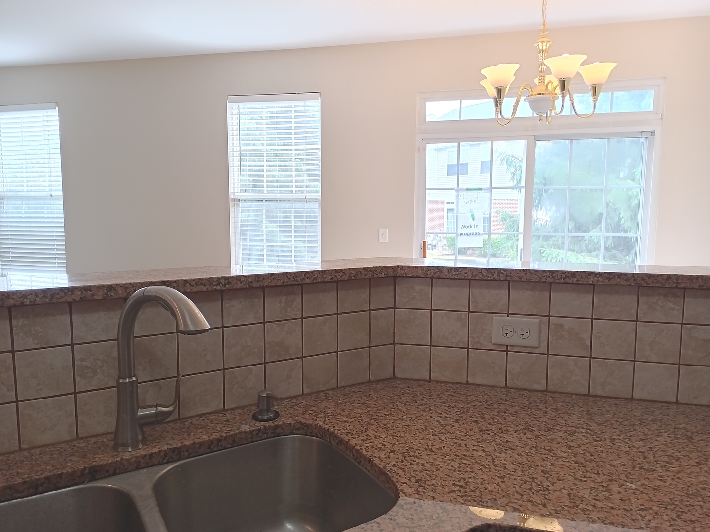 24213 Walnut Circle Plainfield, IL 60585 - Photo 3 of 15 a bathroom with a sink a bathtub and window