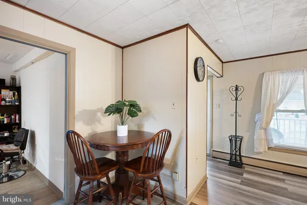 a dining room with furniture and window