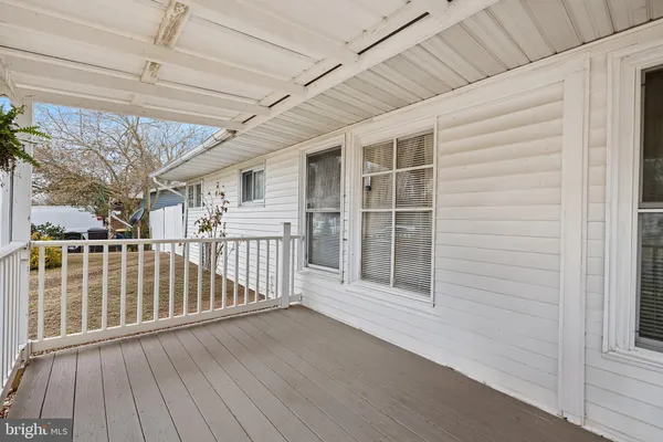 a view of porch with wooden floor