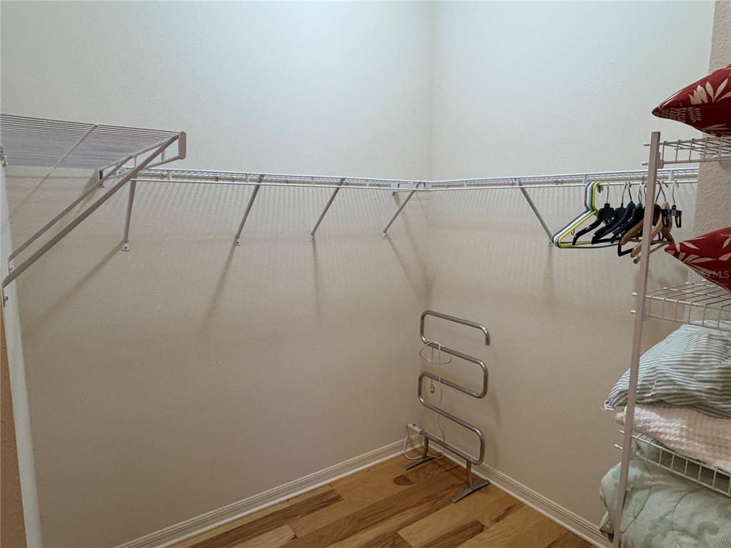 3436 Countryside Path The Villages, FL 32163 - Photo 21 of 31 a view of storage and utility room with racks on the wall