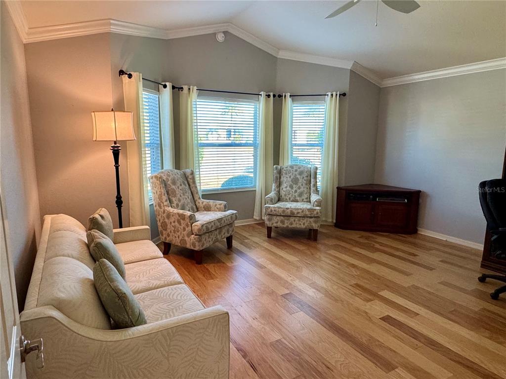 3436 Countryside Path The Villages, FL 32163 - Photo 22 of 31 a living room with furniture and a large window