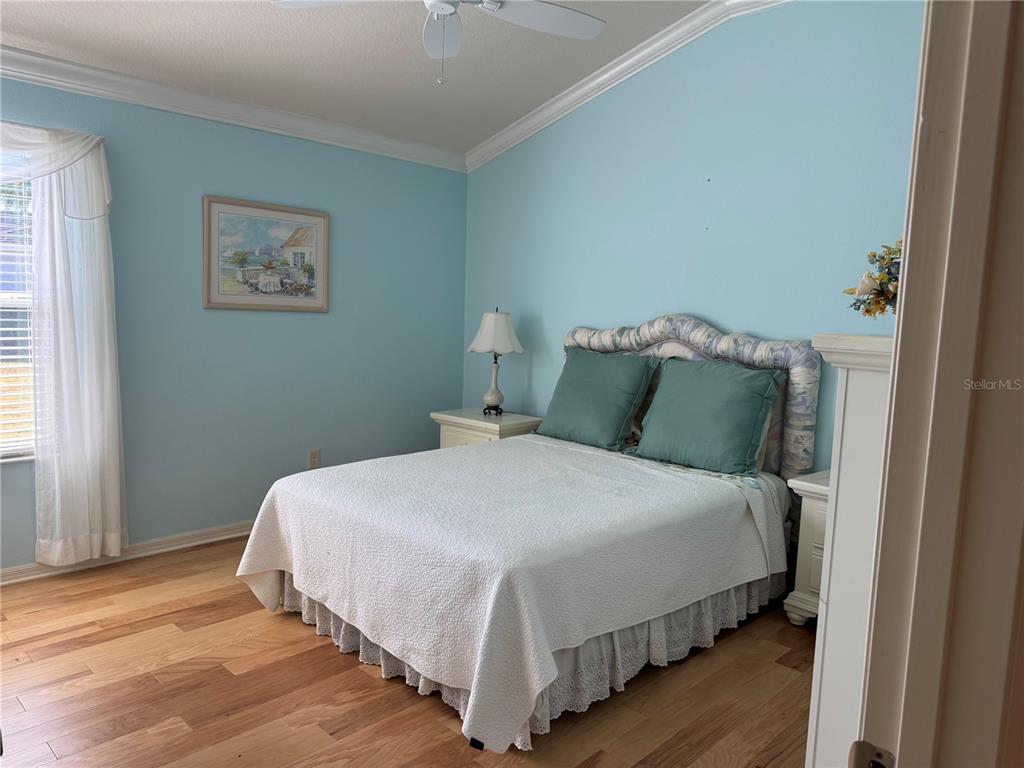 3436 Countryside Path The Villages, FL 32163 - Photo 25 of 31 a bedroom with a bed and wooden floor