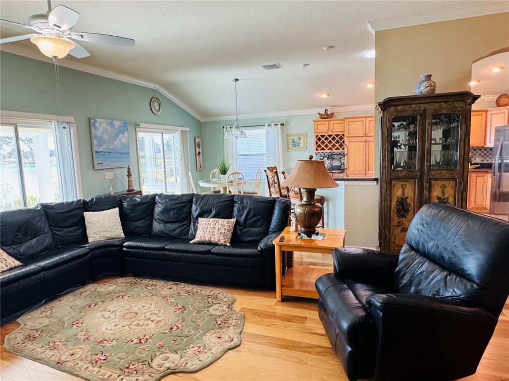 3436 Countryside Path The Villages, FL 32163 - Photo 5 of 31 a living room with furniture and a fireplace