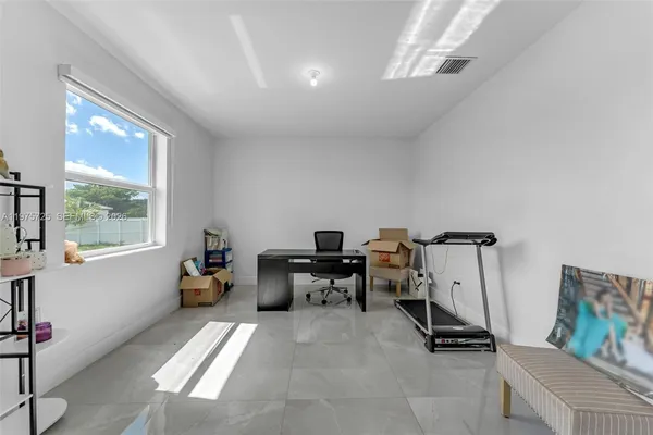 a bedroom with a bed closet and a window