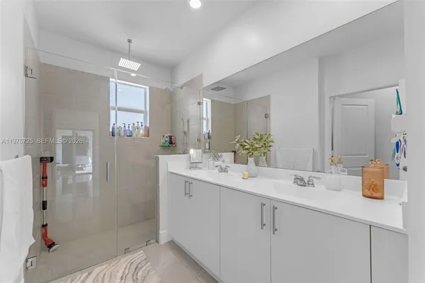 a white toilet sitting next to a white sink