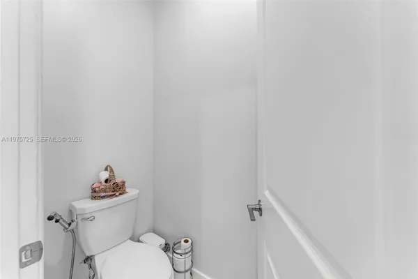 a bathroom with double sink and a mirror