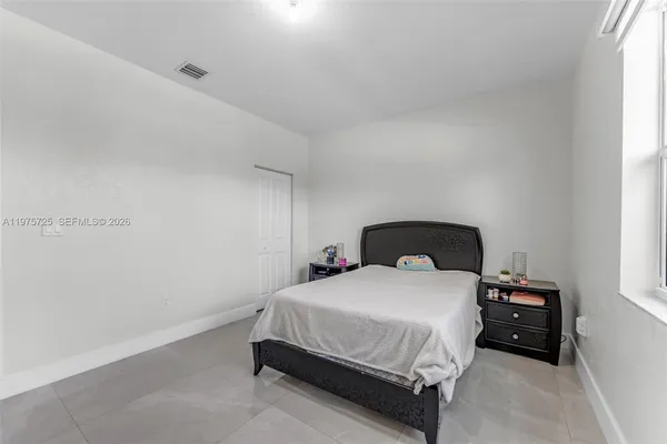 a bathroom with a sink a toilet and shower curtain