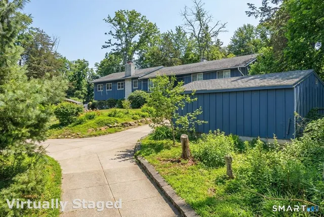 a view of a backyard with potted plants