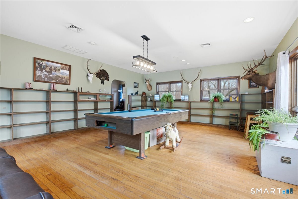 110 Butlertown Road Waterford, CT 06385 - Photo 13 of 35 a living room with furniture and wooden floor
