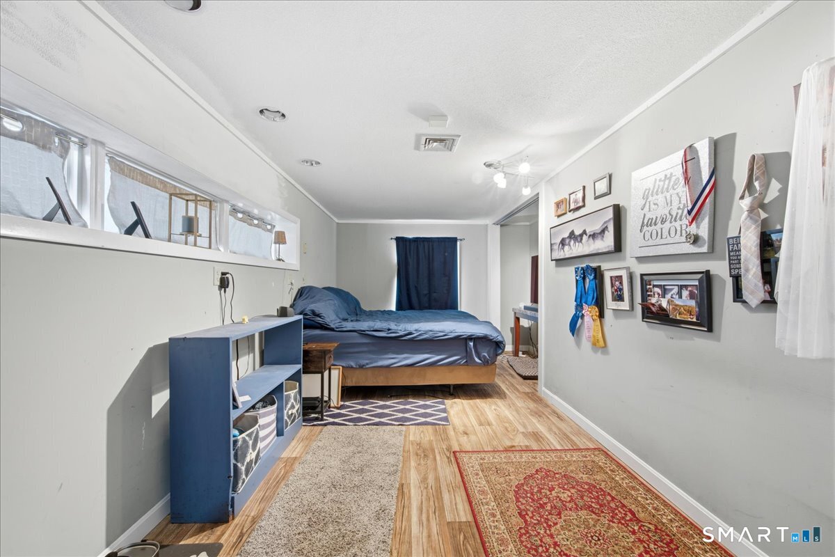 110 Butlertown Road Waterford, CT 06385 - Photo 24 of 35 a living room with furniture and kitchen view