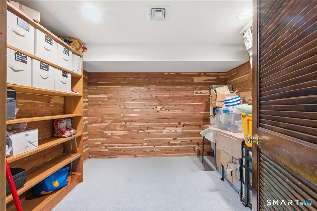 110 Butlertown Road Waterford, CT 06385 - Photo 27 of 35 a view of walk in closet with clothes and shoes