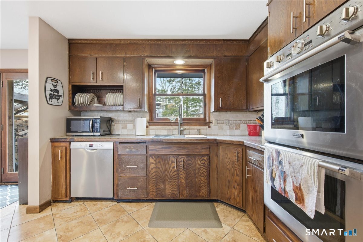 110 Butlertown Road Waterford, CT 06385 - Photo 4 of 35 a kitchen with stainless steel appliances granite countertop a sink and cabinets